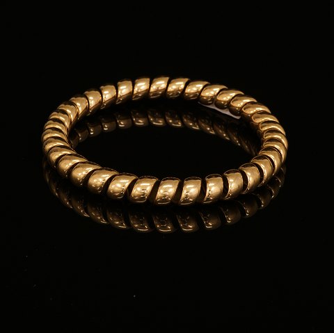 Anton Michelsen: Spiral armring af 14kt guld. 
Stemplet. D: 7,7cm. V: 31,2gr