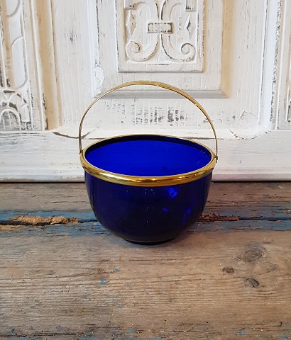 Sugar bowl with brass handle.
