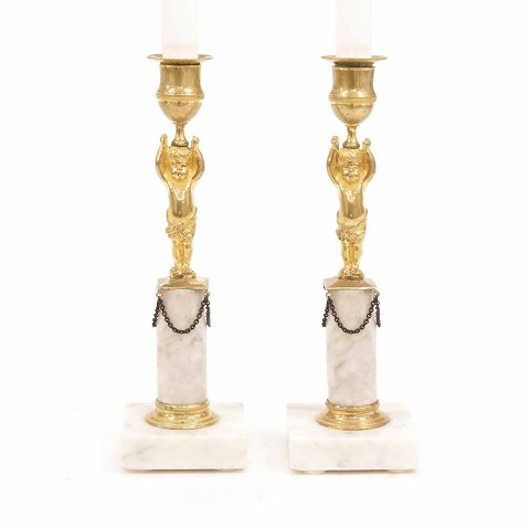 A pair og gilt early 19th century bronce 
candlesticks. France circa 1810. H: 25cm