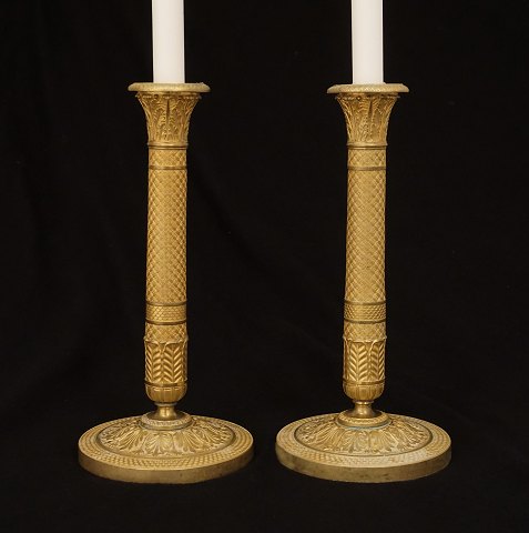 A pair of early 19th century gilt bronze 
candlesticks. France circa 1810. H: 29cm