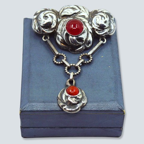 Bernhard Hertz; An Art Nouveau silver brooch set with carnelians