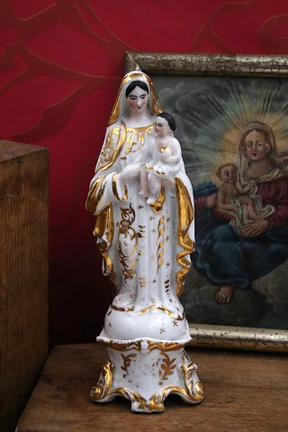 Decorative, old Madonna figurine in porcelain of the Virgin Mary with the baby 
Jesus...