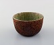 Helle Allpass (1932-2000). Unglazed stoneware bowl with beautiful inside glaze 
in light blue-green shades. 1960 / 70