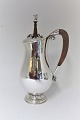 Lundin Antique 
presents: 
Georg 
Jensen. 
Chocolate jug 
with stirrer. 
Sterling (925). 
Model 460B. 
Design Georg 
Jensen.