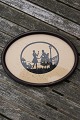 Silhouette clip in oval mahogany frame, romantic 
scene at lamp post