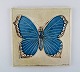 Lisa Larson for Gustavsberg. Wall plaque in glazed ceramics with butterfly. 
1970