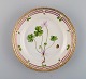 Royal Copenhagen Flora Danica salad plate in hand-painted porcelain with flowers 
and gold decoration. Model number 20/3573.
