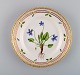 Royal Copenhagen Flora Danica salad plate in hand-painted porcelain with flowers 
and gold decoration. Model number 20/3573.
