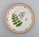 Royal Copenhagen Flora Danica dinner plate in hand-painted porcelain with 
flowers and gold decoration. Model number 20/3549.
