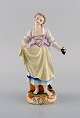 Antique Meissen figure in hand-painted porcelain. Girl with grapes. Marcolini 
period 1774-1814.
