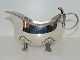 Silver
Gravy boat in heavy quality with flower handle 
and on four feet