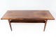 Coffee table in rosewood with shelf, of Danish design from the 1960s.
5000m2 showroom.