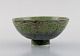 Eli Keller (b. 1942), Sweden. Unique bowl in glazed stoneware. Beautiful crystal 
glaze in shades of green. 21st Century.
