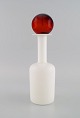 Otto Brauer for Holmegaard. Vase / bottle in white art glass with red ball. 
1960s.
