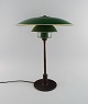 Poul Henningsen (1894-1967). PH 3½-2 table lamp with socket housing of brass / 
metal, wire shade holders mounted w / shade set of green-painted zinc. 1940s.
