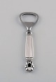 Georg Jensen Acorn bottle opener in sterling silver and stainless steel. 
