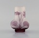 Antique Emile Gallé vase in frosted and purple art glass carved in the form of 
flowers and foliage. Early 20th century.
