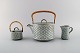 Jens H. Quistgaard (1919-2008) for Bing & Grøndahl / Nissen Kronjyden. Gray 
Cordial teapot, sugar bowl and creamer in glazed stoneware. 1960s.
