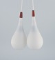 A pair of "Louis Poulsen" pendants in opal glass and teak.