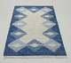 Swedish textile designer.Handwoven carpet in pure wool. Rölakan technique.