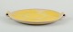 Finnish ceramic dish in Art Deco style. With two handles.Yellow glaze. Hand painted.