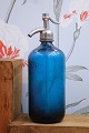 K&Co. presents: 
Decorative, 
old French 
glass siphon in 
blue with 
engraved 
writing on the 
side of the 
siphon...