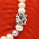 Ole Lynggaard; "Morgendug" Clasp of 18k white gold, set with diamonds