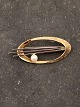 Middelfart Antik præsenterer: 14 karat guld broche med ægte perle