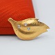 Antik Damgaard-Lauritsen præsenterer: Ole Lynggaard; Broche af 14 kt. guld med diamanter