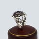 Antik Damgaard-Lauritsen præsenterer: Georg Jensen; Moonlight Blossom ring af sterling sølv med sorte agater, ...