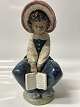 Antik Huset præsenterer: Lladro, Spansk figur: Pige med bog.Højde 21,5 cm.