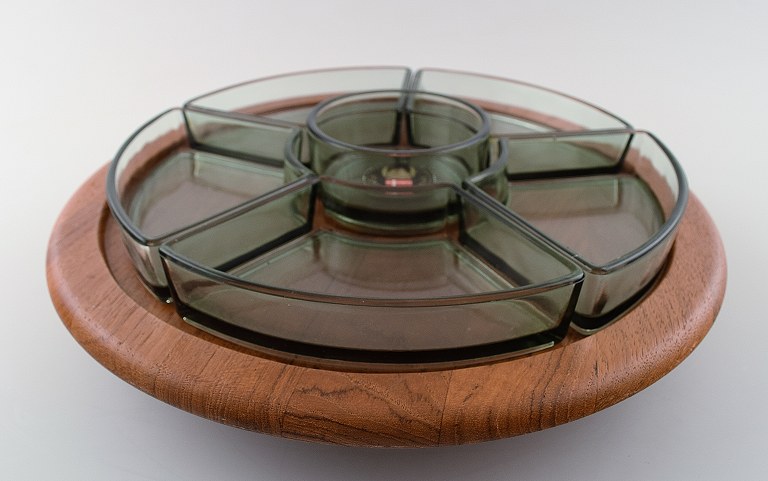 Flemming Digsmed, round cabaret dish on swivel base, teak with inserts of 
colored glass.