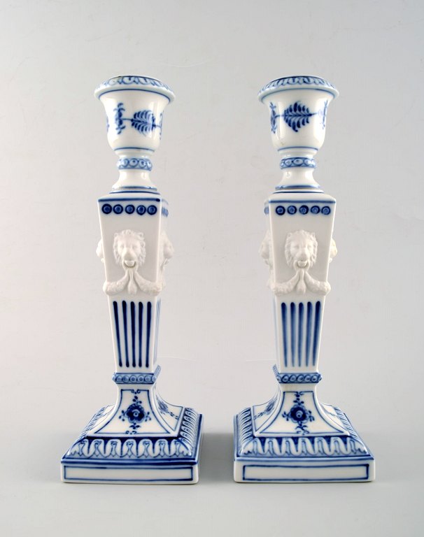 A pair of Royal Copenhagen Blue Fluted plain, candlesticks with lion heads.