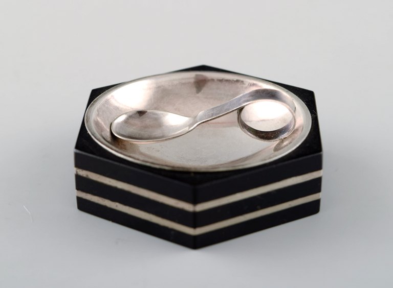 GAB (Guldsmedsaktiebolaget) art deco hexagonal salt cellar in silver and ebony 
with matching salt spoon.