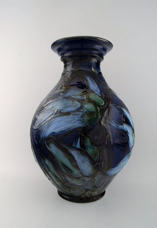 Kähler, Denmark, glazed stoneware floor vase decorated with flowers in blue 
shades.