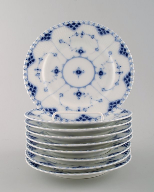 A set of 9 pieces. Antique blue fluted full lace flat plates from Royal 
Copenhagen.
