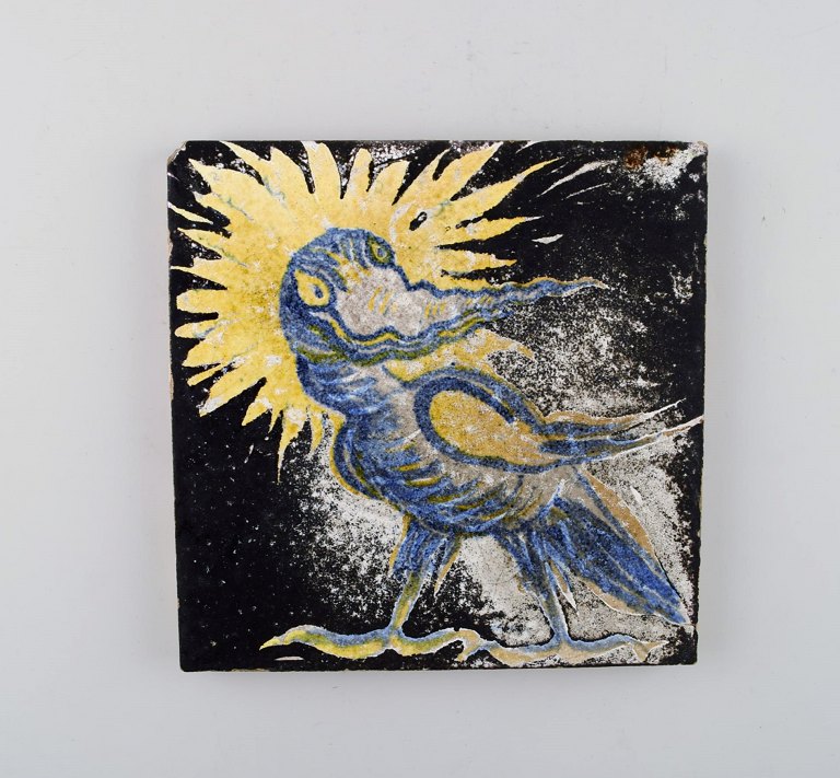 Jens Thirslund for Kähler, Denmark. Unique stoneware tile with bird motif. 1920 
/ 30