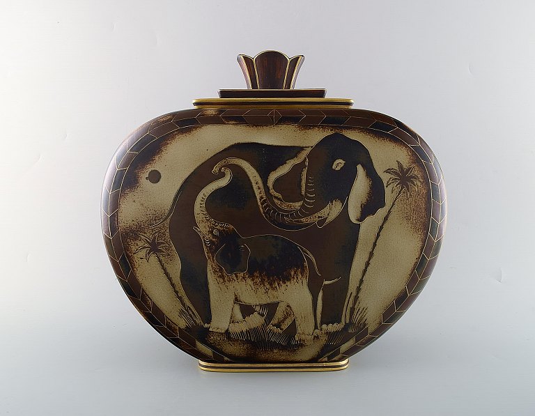 Gunnar Nylund for ALP Lidköping. Large unique hand crafted Art Deco Flambé 
lidded jar with elephant motifs. 1930