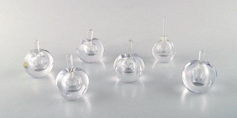 Vicke Lindstrand for Kosta Boda. A collection of six mouth blown perfume bottles 
in clear art glass. Designed in the 1960s.