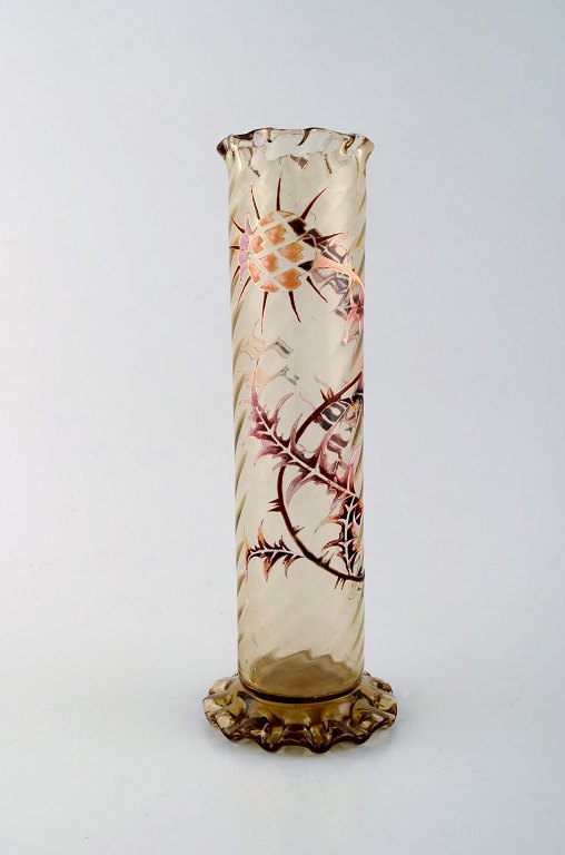 Early Emile Gallé vase in clear frosted art glass. Carved with motifs in the 
form of flowers and leaves. Angular bottom and top. Enamel work and gilt. Ca. 
1885.