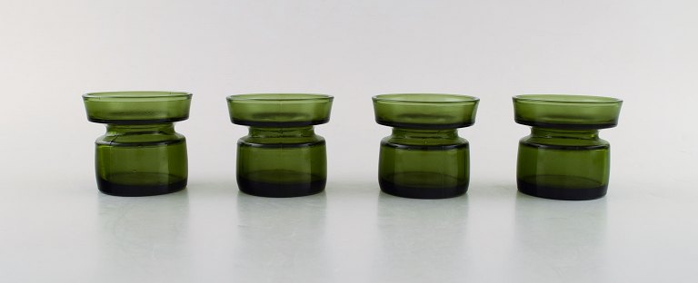 Jens Harald Quistgaard. Four "Hygge" light holders for teacandles in dark green 
art glass. Retro, 1960