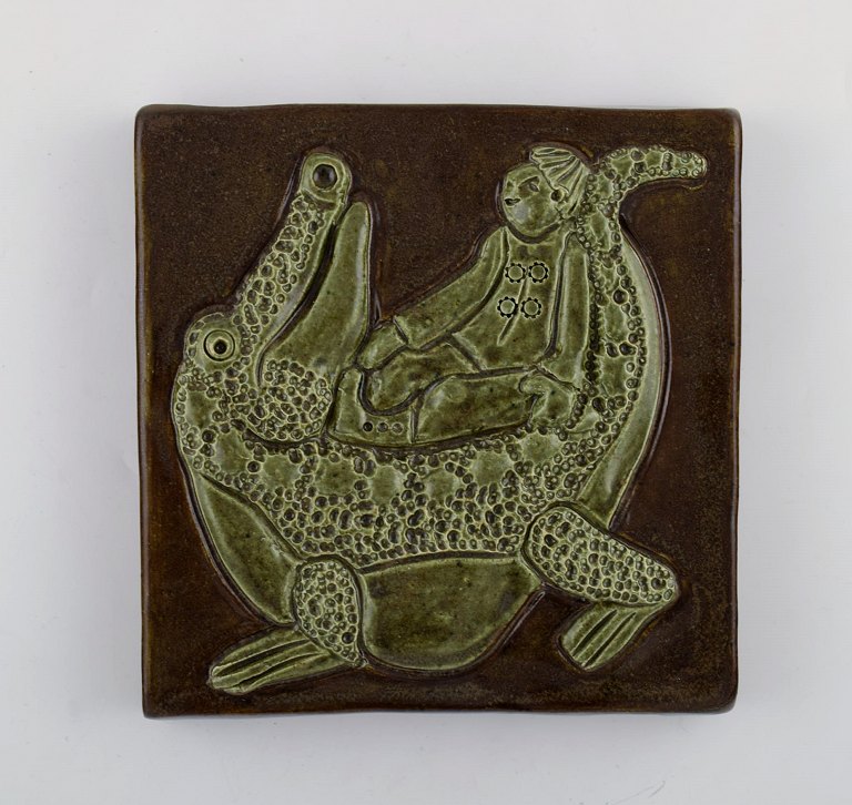 Otto Klaesson for Höganäs. Wall plaque in glazed stoneware with boy and 
crocodile motif. 1970