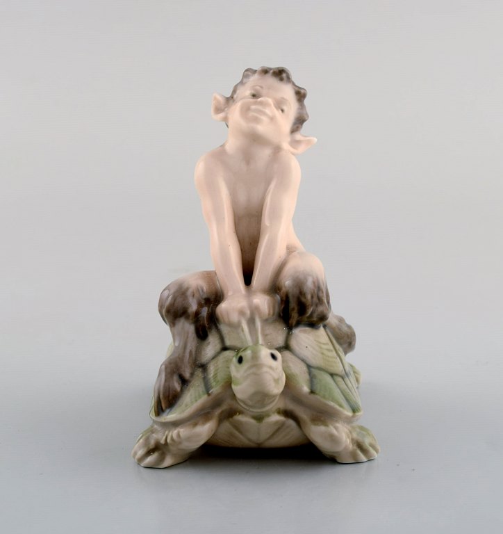 Royal Copenhagen Figurine Faun (Pan) on a turtle.
