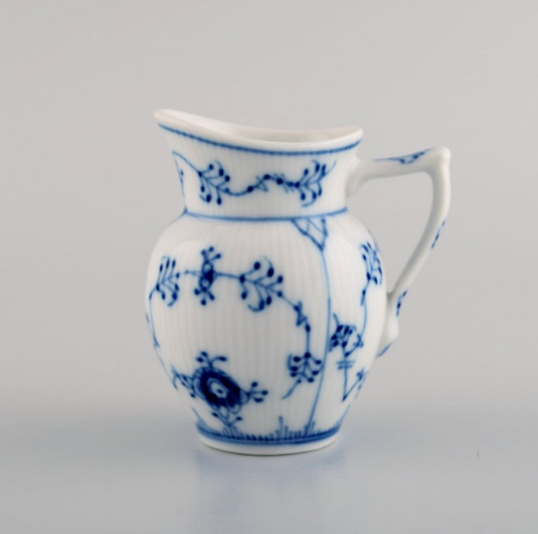 Royal Copenhagen blue fluted plain creamer in porcelain. Model number: 1/59.
