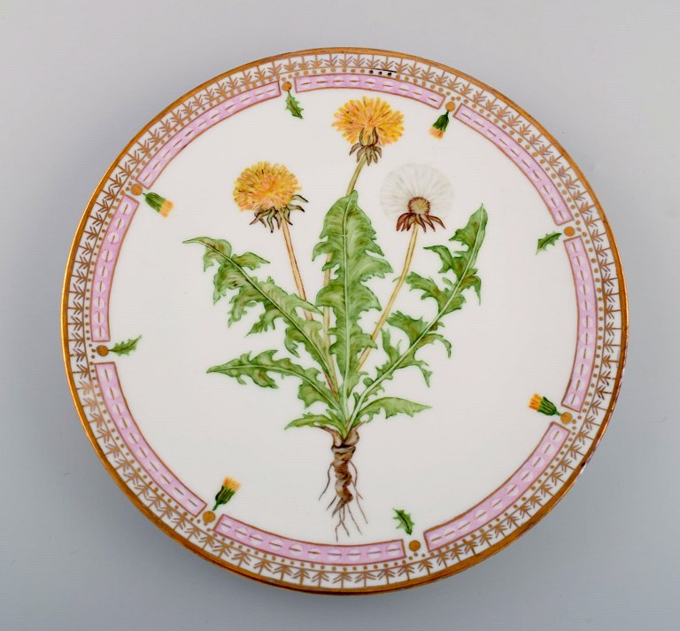 Dinner plate in Flora Danica style. Hand-painted flowers and gold decoration. 
Mid-20th century.
