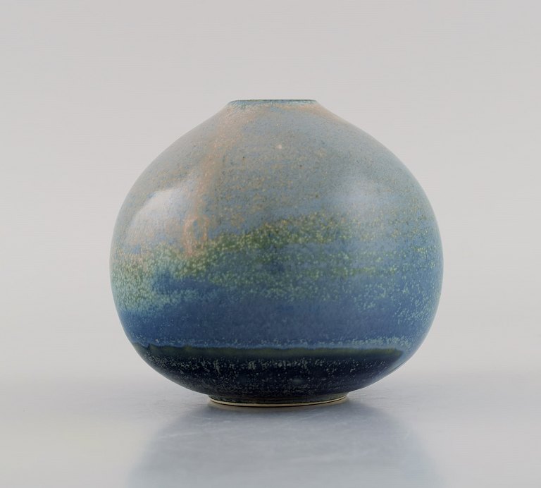 Swedish ceramicist. Unique vase in glazed ceramics. Beautiful speckled glaze in 
blue and green shades. Late 20th century.
