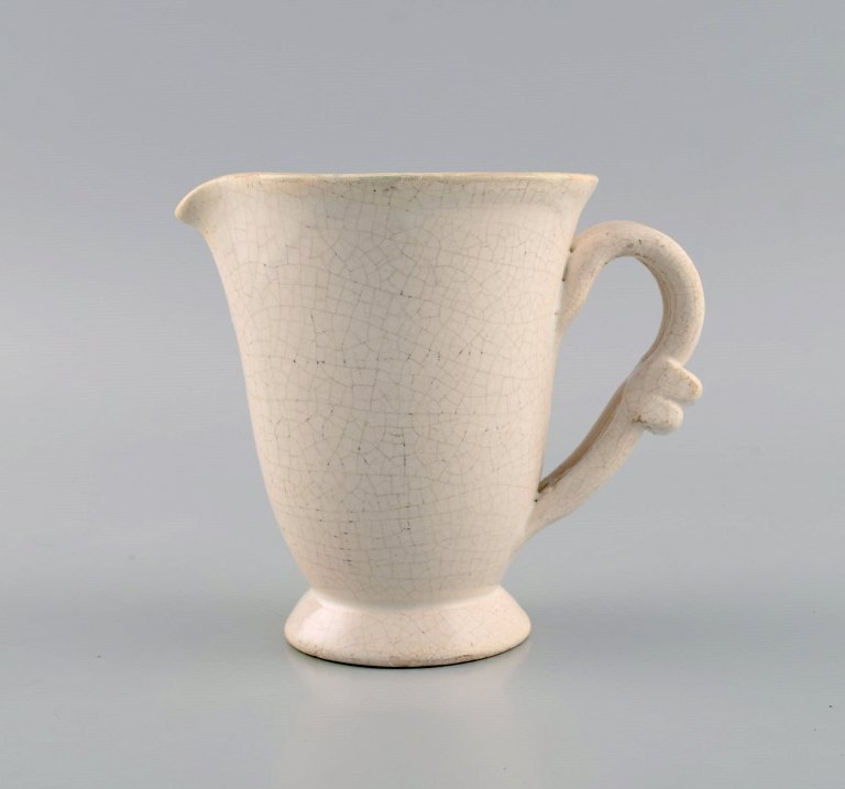 Suzanne Ramie (1905-1974) for Atelier Madoura. Unique art deco jug in glazed 
stoneware. Beautiful crackle glaze in sand shades. Mid-20th century.
