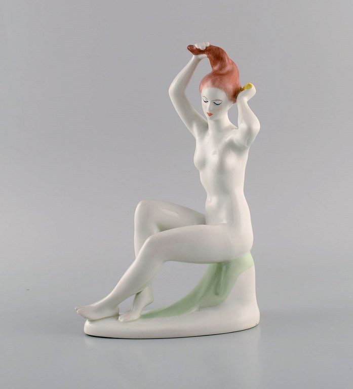 Aquincum, Budapest. Hand-painted art deco porcelain figurine. Naked woman 
combing her hair. 1940s.
