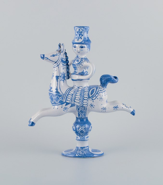 Bjørn Wiinblad ceramic figurine from "Det Blå Hus" (The Blue House).
Figurine/candle holder of a horseback rider with space for a candle.