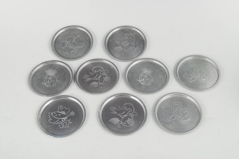 Just Andersen, sæt af ni flaskebakker i tin.